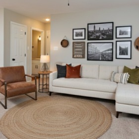 Living room with couch, accent chair and rug