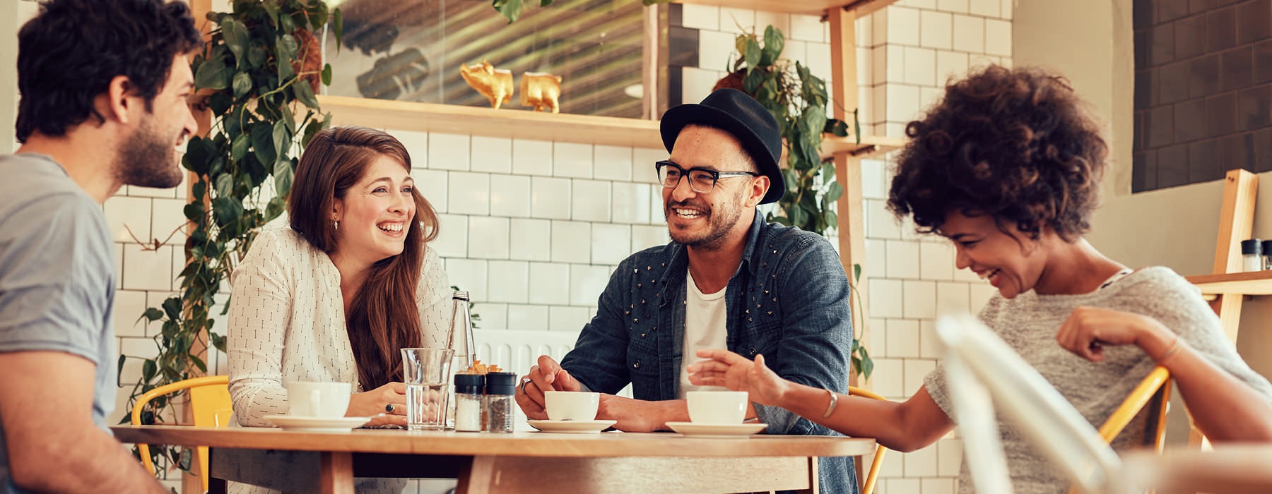 residents laughing and hanging out at local cafe